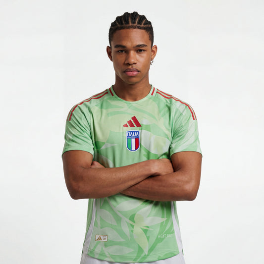 Light green Italy 25/26 player training jersey with leaf pattern, red shoulder stripes, Italia crest