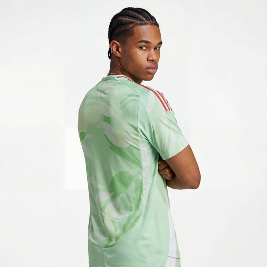 Light green Italy 25/26 player training jersey with floral pattern, red shoulder stripes